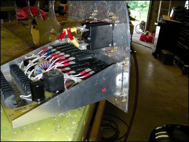 Cut holes for master switch and power panel.  Install nuts with flush rivets so this unit can be removed at any time with out the need to get behind the panel.