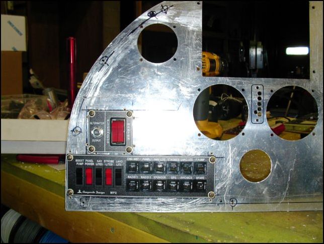 Cut holes for master switch and power panel.  Install nuts with flush rivets so this unit can be removed at any time with out the need to get behind the panel.