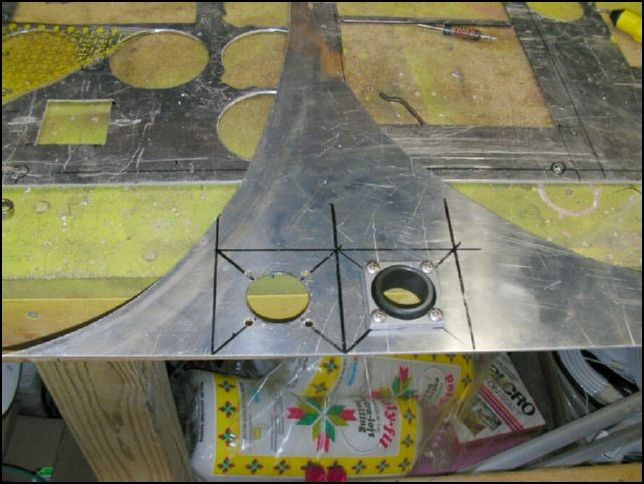 Mark out two plates to hold the control rod bearings and drill holes in center of each one so that the bearing center can move freely.  Drill bolt holes to hold bearings to plate.