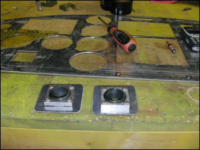 Bolt control bearings to mounting plates.