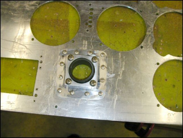 Remove the instrument panel and rivet the bearings to the panel.  I used 12 solid rivets for each bearing.  These are not going to ever come off!