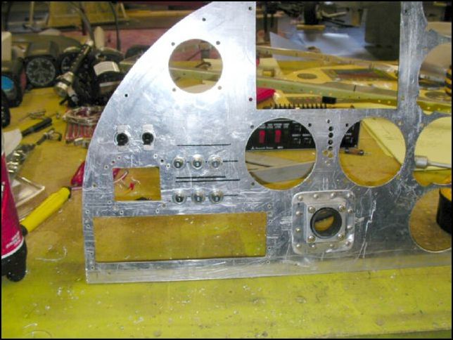 Drill holes for breakers.  The two top left ones are for my electronic ignitions.