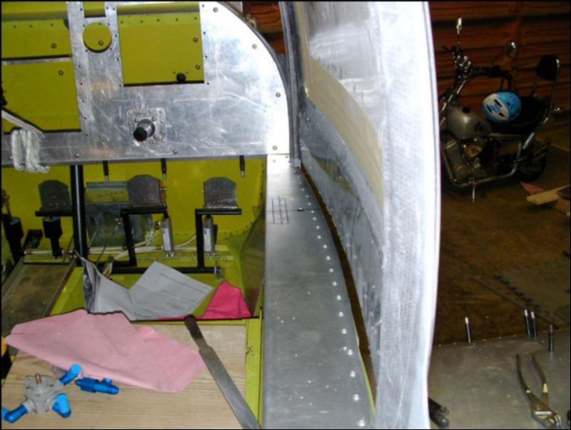 Install canopy door latch bars under the longerons armrest area about 230 mm back from instrument panel.