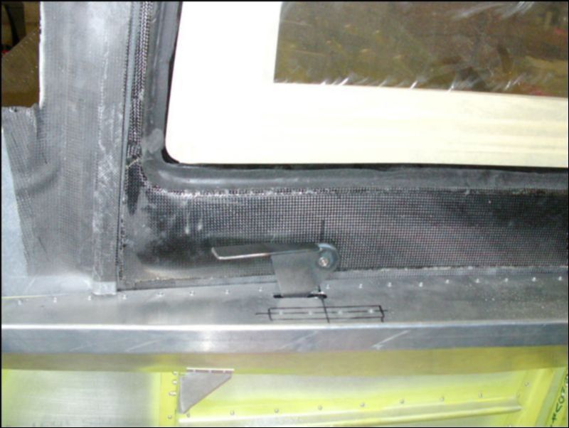 Cut slot in top longeron for door latch and test it's function.  I had to grind the latch a bit to make it work properly.  Don't grind off too much or your door will not close securly.