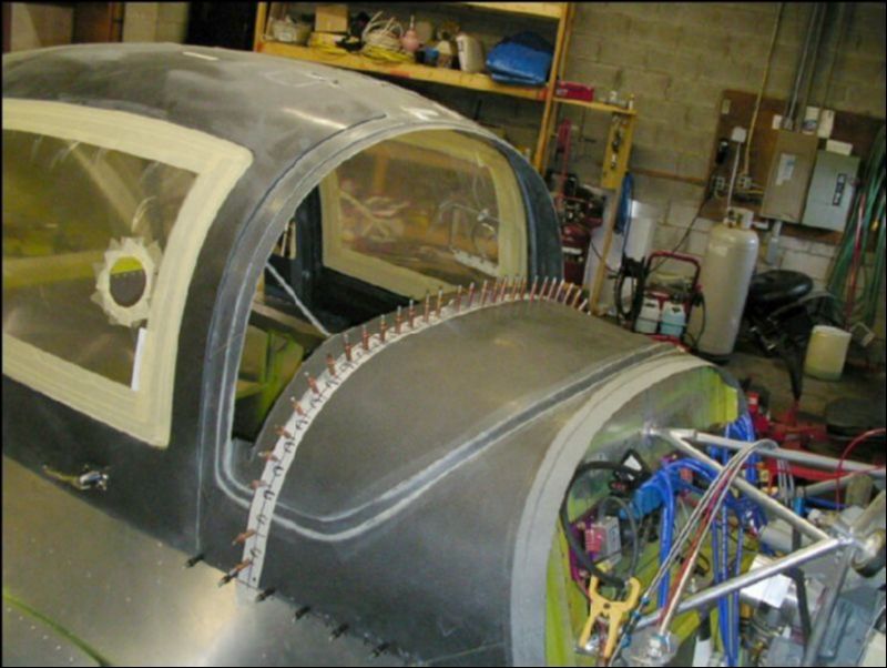 Position the template you made over the canopy, it will be off a little because of the thickness of the canopy, but you will still know where the crimps are at so that you can avoid drilling in those areas.