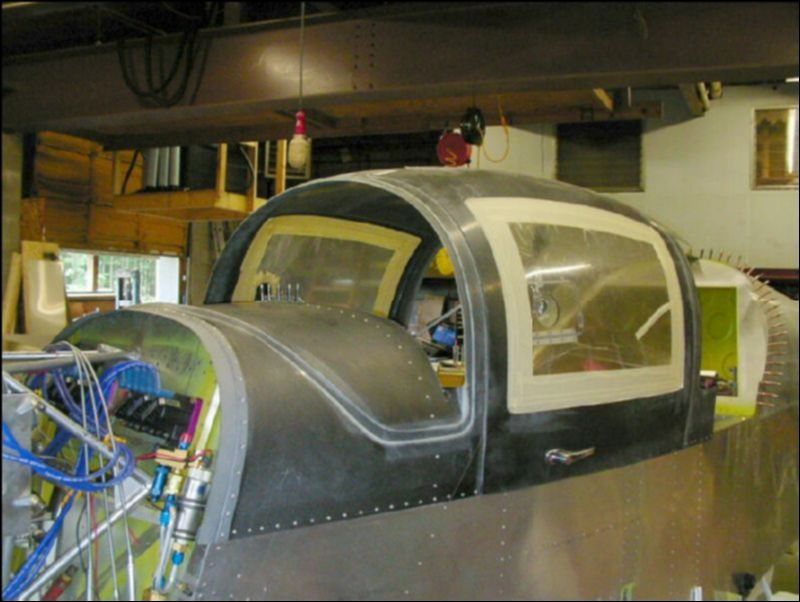 Remove the canopy, deburr all rivet holes, reinstall the canopy and rivet in place.  Do not rivet the handle to the center of the dash yet.  You will want to cover the dash first then install the handle on top of what ever you use to cover the dash.