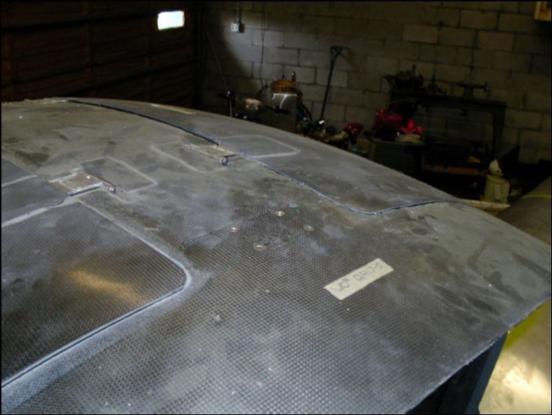 This is the top view of the screws that hold the rollover bar.  Notice they are flush mounted.