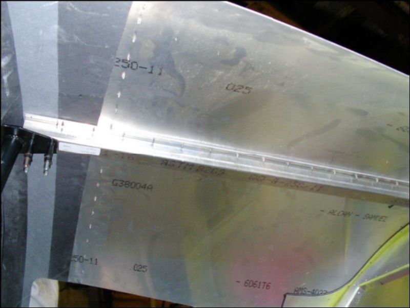 Install the center channel between the rollover bar and the top skin.  Drill and cleco in place.