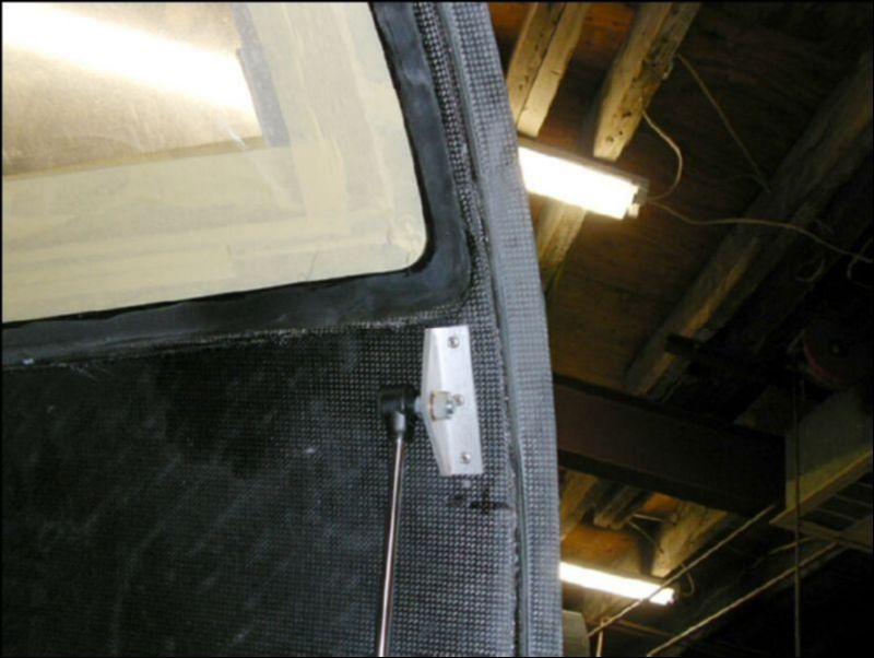 Install the door strut bracket to both doors.  This can be fun to position correctly.  You must make sure that when the door is close the strut is not fully compressed.  I found that the drawings were off on the positioning of this part by about 30 mm.  By this I mean that mine is 30 mm closer to the window from the bottom of the door.  I measured from the very bottom of the door, perhaps the drawings where going from the lip on the door, this would make them just about right. 