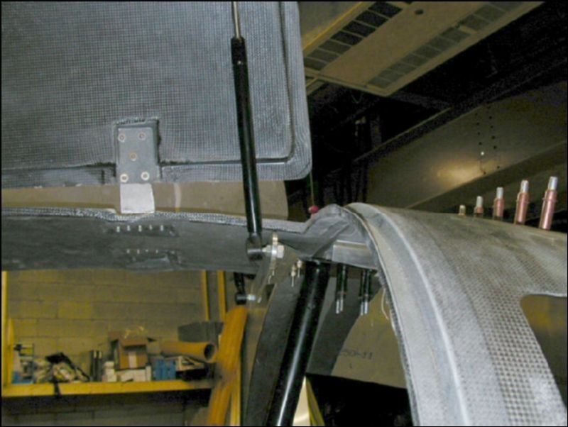 Bolt the door struts to the bracket on the door and to the bracket on the rollover bar