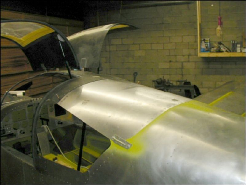 Deburr, clean, and prime the top skin, center channel, rear seatbelt attachment bracket, and side handles.  Install the screen in the top vent hole, apply sealant to the rivet lines and rivet together.