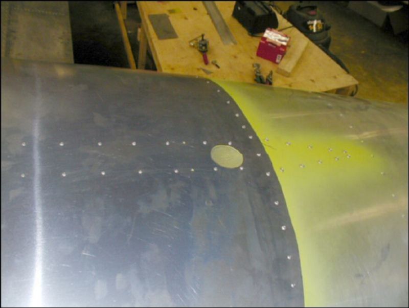 Top view of top skin riveted in place with the vent screen installed.