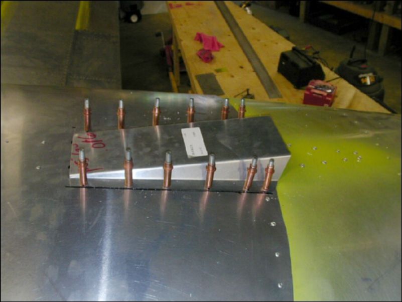 Drill and cleco the top air vent cover over the air vent hole on the top of the fuselage.