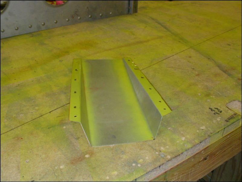 Deburr, clean, and prime the air vent cover.