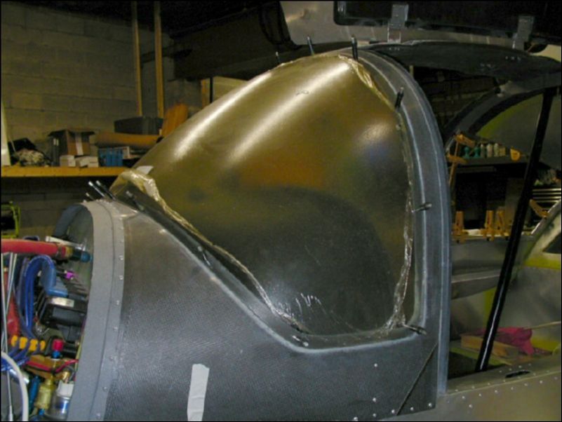 I did not like the idea of the windshield being held in with just glue so I drilled and clecoed the windshiled in place and will rivet it after it is glued in place.