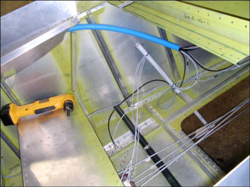 Remove the rear seat and drill out the rivets for the rear seat back, baggage area bulk head and floor.  OK, now I am REALLY upset!  I contacted Zenair and they have new prints for the rear seat area.  It sure would have been nice to know this BEFORE I had made my seats!