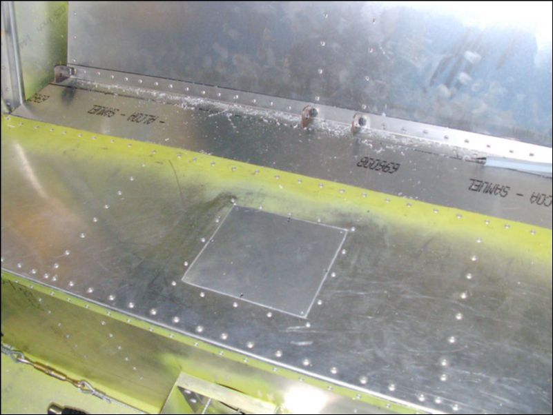 Fit the cover for the access hole in the rear seat bottom.