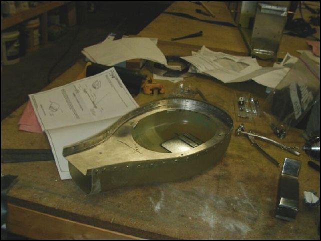 This image does not show this very well, but I riveted nutplates and filter brackets to the mounting holes, then riveted the top filter plate to the fiberglass airbox with solid a3 rivets