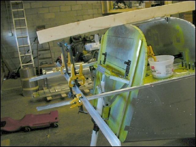 I clecoed long angles to each side of the fuselage that line up with the top longerons.  I will use these as a reference to make sure that my engine center line is at the same angle as the top longerons.