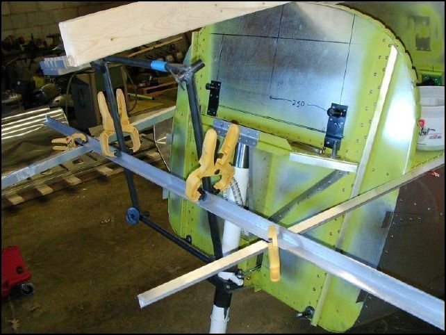 Clamped another L across the two Ls that are connected to the top longerons 200 mm forward of the nose gear to make sure that the rear of the engine will clear the nose gear.