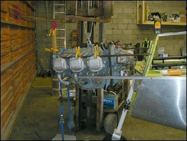 This is how we lined up the engine.  We attached extensions to the top longerons to give us a guide for nose up or down and clamped rods to the top of the engine on both sides which we used as a guide of where they would contact the firewall.  This made it simple to square off the engine to the firewall and then move the rear of the engine 2.49 inches to the left (toward the pilot).