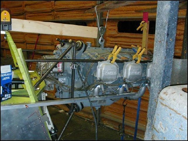 OK, now that I am happy with the position of the engine it is time to get it welded in place.  First I measured the distance from the lower engine mount to the lower right corner of the dynafocal ring.  Then I calculated the angles needed for both ends of the rod and cut the rod to fit.  I had very little grinding to do to make this fit perfectly.  Then I welded this rod in place.  Next, I checked the position of the engine again to make sure that everything was still exactly where they should be.  Then repeat for the upper right engine mount rod.