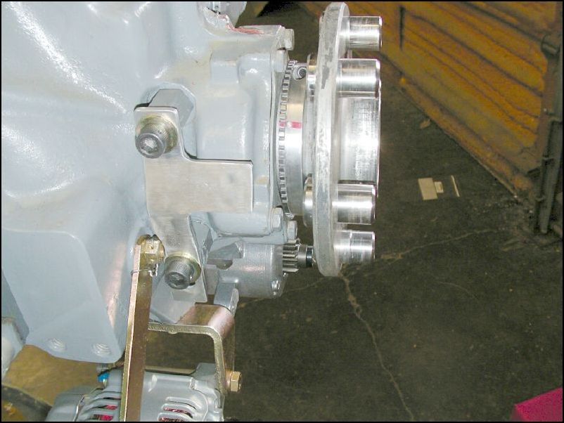 Install timing ring to front of engine and install Y bracket to side of engine.