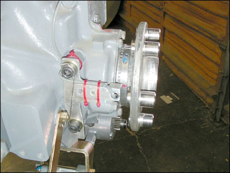 Install electronic ignition pickup to Y bracket and set gap.