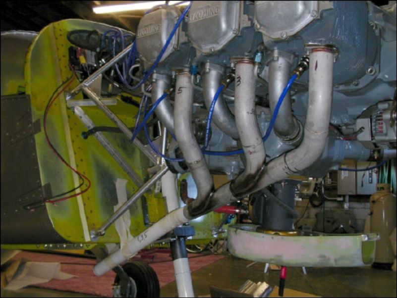 Bolt exhaust to engine and cut PVC pipe to form the extension.  Tape the pipe in place then cast it with gauze tape, baking soda, and super glue.  This makes a nice cast so that I can now send the exhaust pipes out to be formed and welded.