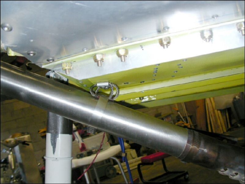 Install two exhaust stand offs to bottom of fuselage for each pipe.