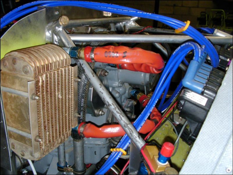 Install the oil cooler hoses to the engine and oil cooler.