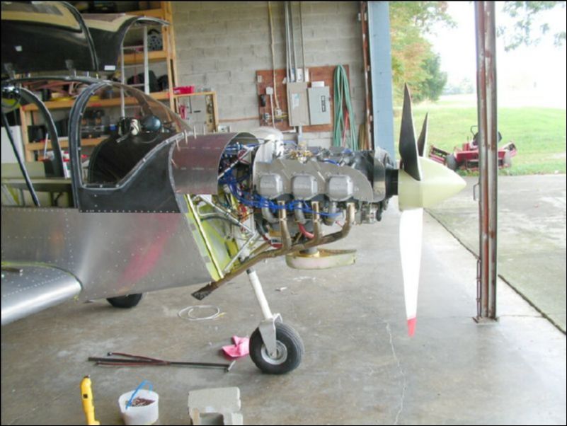 It's time to modify the cowling to fit the engine that I have installed.  So, let's start by forming a top cowling extension.  Drill the extension and cleco it to the fuselage.  The cleco locations will later be replaced with camlocks.