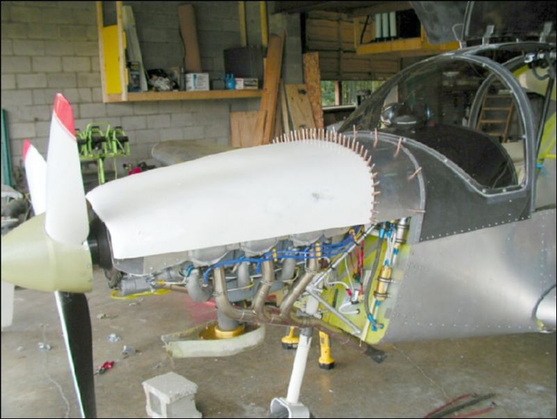 Postion top cowling, drill and cleco it to the top cowling extension.