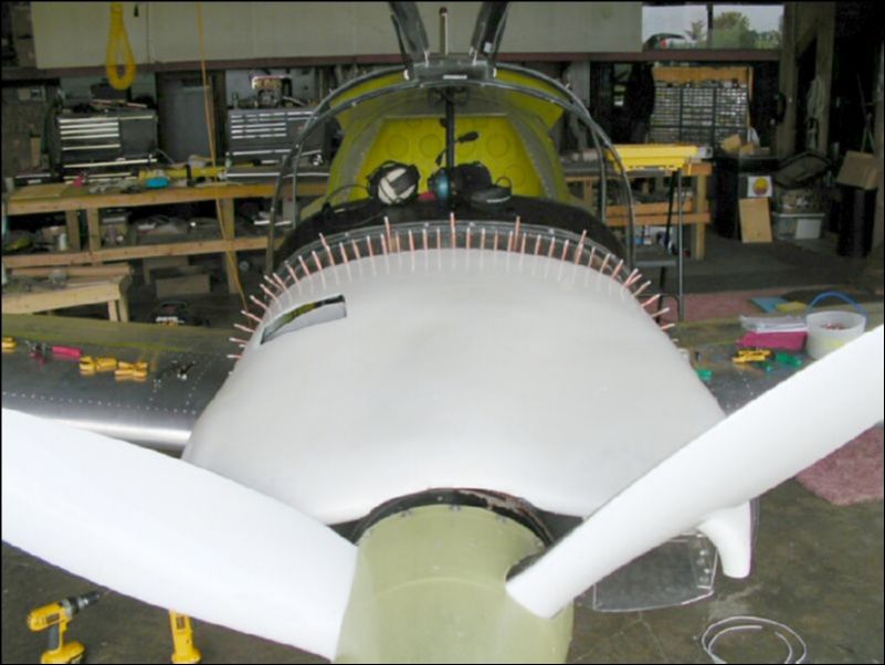 Postion top cowling, drill and cleco it to the top cowling extension.