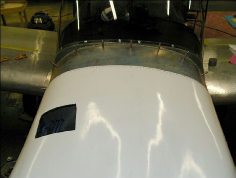 Position the bottom cowling, drill and cleco it to the top cowling in the locations where the camlocks will be installed.  Rivet the top cowling to the top cowling extension.