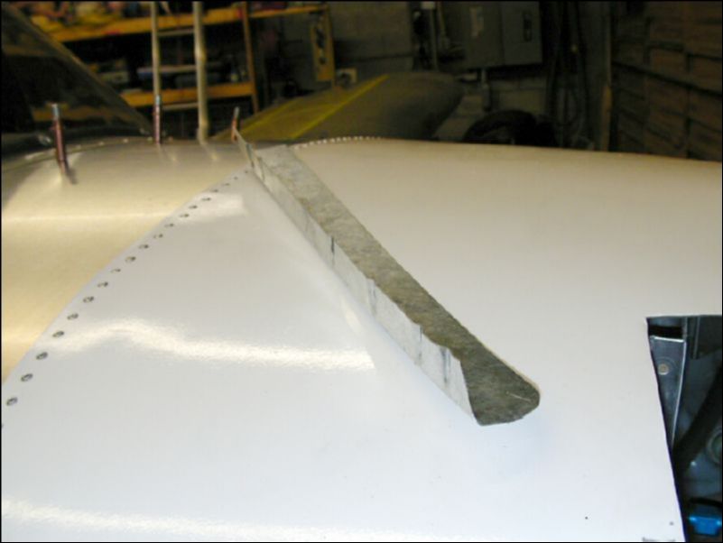 Crimp the bottom cowling attachment L to fit the shape of the firewall.