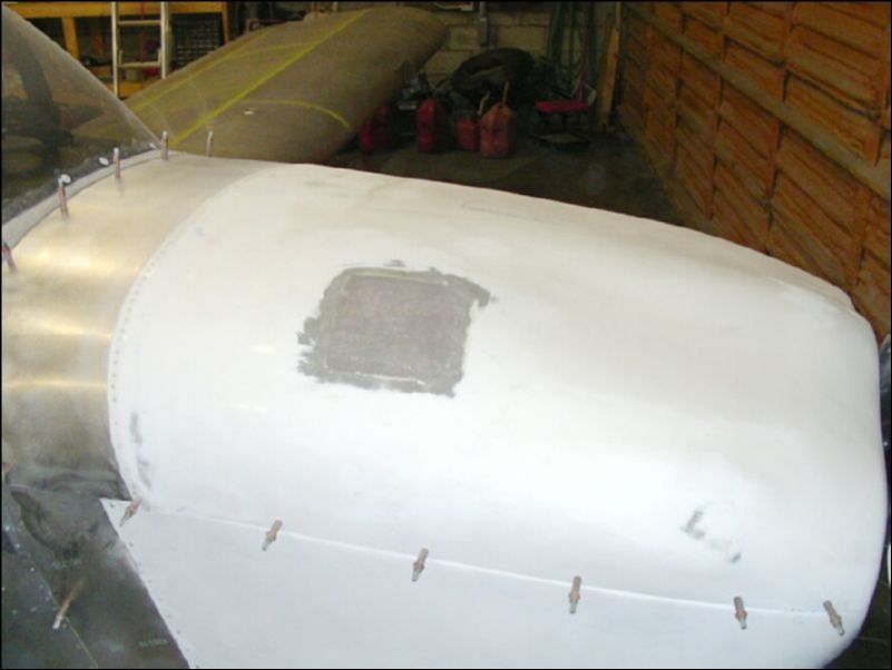 Glass over the top of the old oil access hole.  Let harden then sand smooth.  This is now ready for the first smoothing coat to be applied.