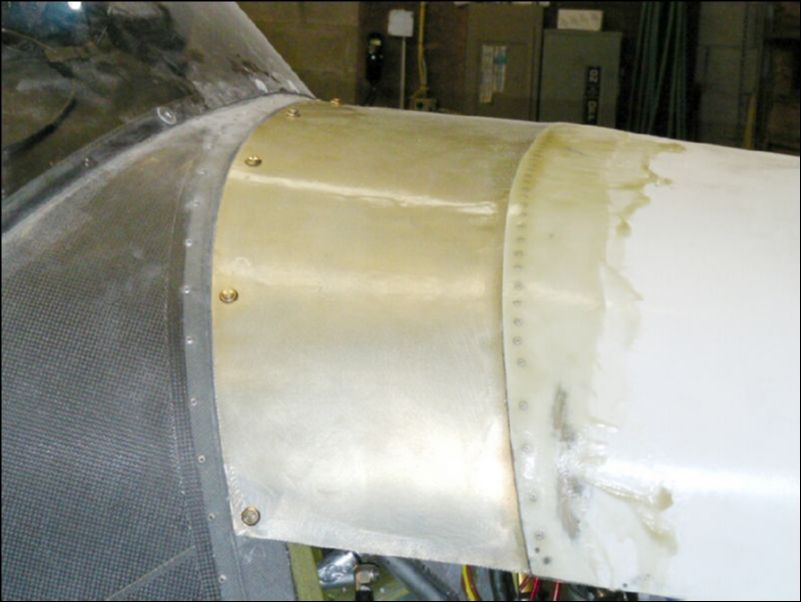 Position top cowling and install camlocs.