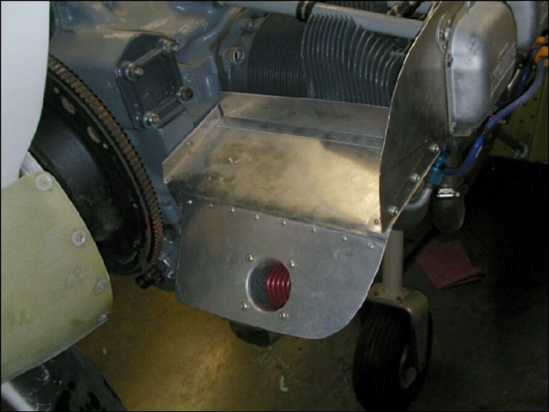 Cut hole in engine baffle for cabin heat ram air.