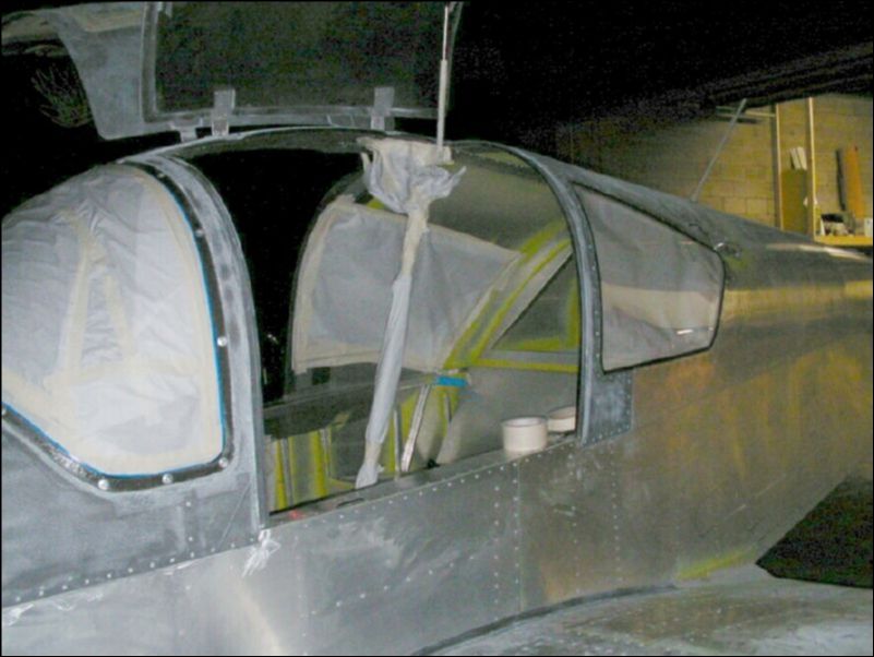 Prep aircraft for primer by sanding all surfaces lightly and masking off everything that we don't want paint on.