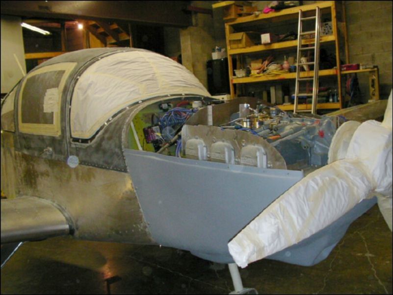 Prep aircraft for primer by sanding all surfaces lightly and masking off everything that we don't want paint on.