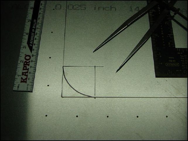 Measure out 250 mm from center line toward each side, then measure from the 1740 mm mark another 620 mm and mark the center line.  Measure out 250 mm from center line toward each side again at this mark.  Connect all your marks to create a box.  Now to create the 50mm radius at each corner measure in from corner 50mm on each side then use a square to extend that mark to the inside of hte box.  Set a protractor to 50 mm and put on point on the spot where the two lines intersect and mark the 50 mm radius.