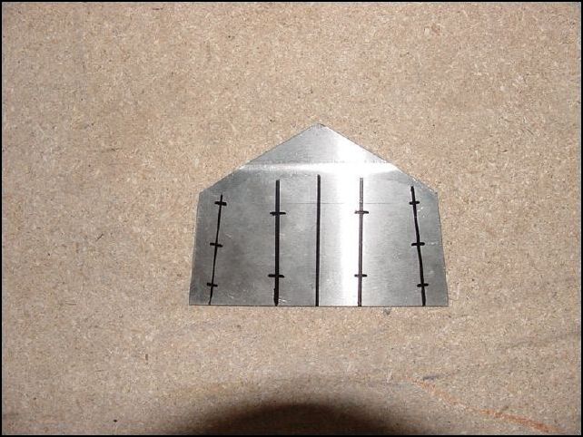 Mark and drill 10 holes for the AD-5 Rivets.  Notice the left and right lines are at an angle.  These lines are 11 mm from the sides  The next lines in on each side are parallel to the center line.  The picture makes it look like they are not but they are in fact parallel.  Each line is 20 mm out from the center line.