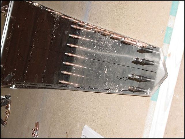 Drill through the lower top rudder hinge into the other parts and cleco to the table.  The 5/16