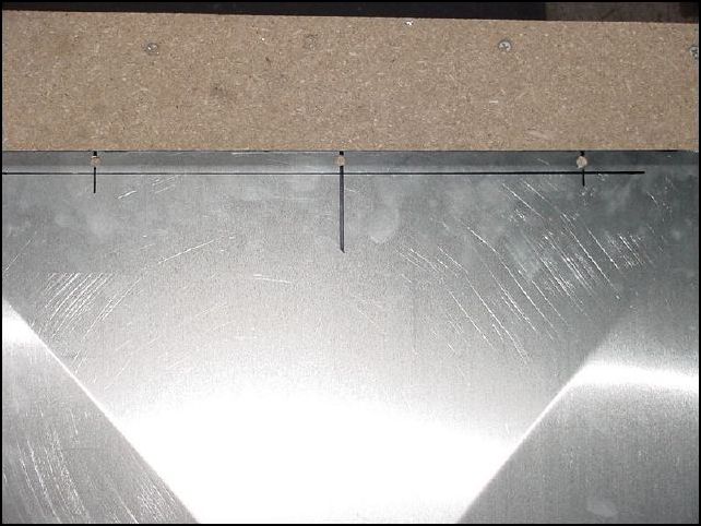 Drill 1/4 inch holes for access door bolts.  Three on the front and four on each sides as per drawings.