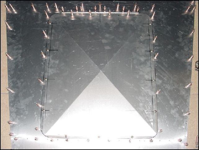 access door bolted in place.