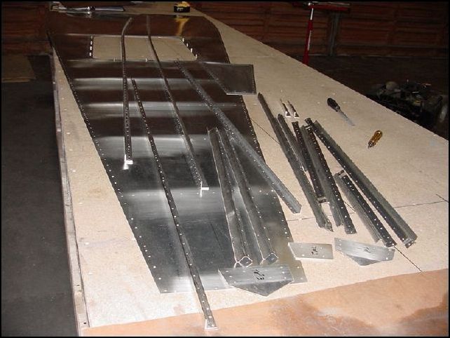 Take assembly apart, debur, clean, prime, and rivet together.  DO NOT RIVET REAR TO FRONT BOTTOM SKIN AREA WHERE HT FRAME WILL GO.  The rear hinge has AD-5 solid rivets.