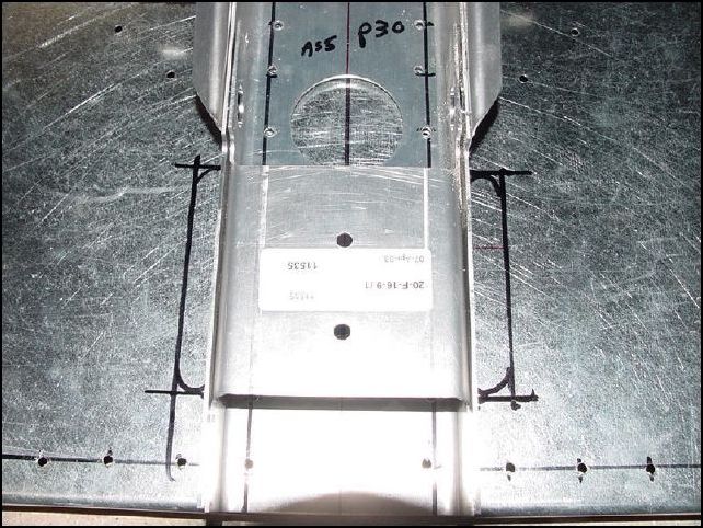 Locate and mark steering rod slots beside channel.  To do this make marks 48 mm and 155 mm up from bottom of firewall, then mark 20 mm from side of center channel and draw line at edge of center channel.  This will give you the top, bottom and sides of the slot.
