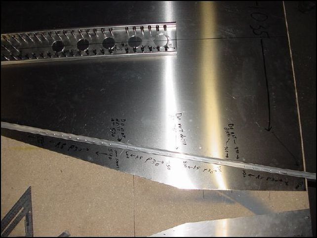 Now mark the rivet locations on the longerons.  measure from front of skin 270mm.  Mark for A5 P30 to 540mm.  Measure from front 600mm and mark A5 P30 to 750mm.  Measure from front 810mm and mark A5 P30 to 930mm.  Measure from front to 1020mm and mark A5 P30 to 1170mm.  We do this so that we do not drill holes in the locations that will have crossing parts on the other side of the skin.