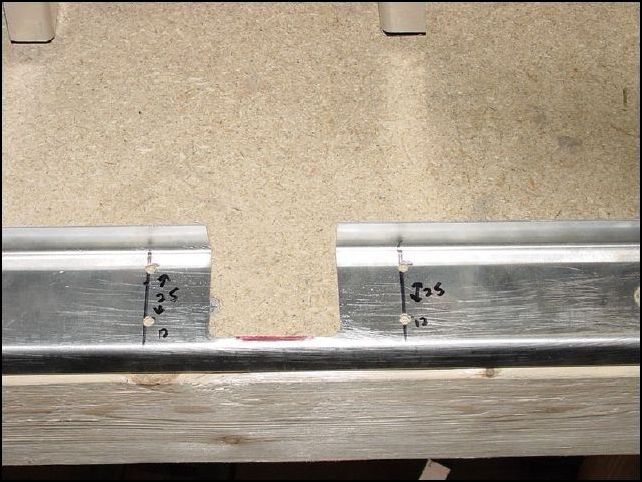 Center the floor Z to the front of the assembly, flush to the bottom of the side walls.  Mark the location of the side walls on the floor z.  Measure up 12 mm then 25 mm for A5 rivets.  Drill these now.